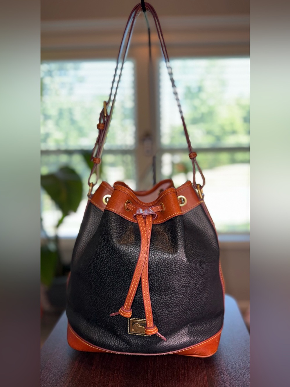 Dooney & Bourke Black and Brown Pebbled Leather Drawstring Shoulder Bag